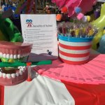 Partners in Education table with goodies and model of teeth