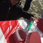 Partners in Education event, a young boy in front of a table with a teeth model 