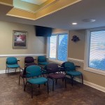 Chairs and TV in the waiting room.