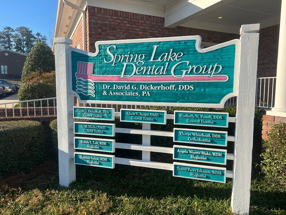 Office sign with doctor names and credentials.